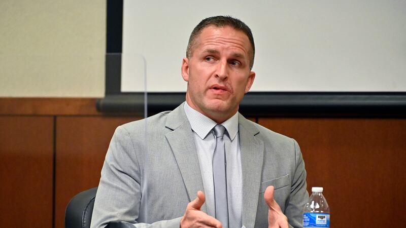 FILE - Former Louisville Police officer Brett Hankison is questioned by his defense attorney...