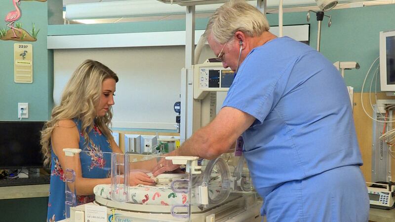 Neonatologist Dr. Darrell Wheeler helped save Tiffany Hlavenka 24 years ago. Now they work...