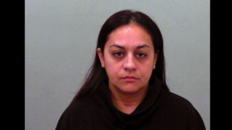 Louisa Theresa Hernandez, 37, was arrested Tuesday on a warrant charging improper relationship...