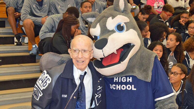 Retired Gen. Robert Shoemaker with the Shoemaker High School mascot in a 2016 photo. (File)