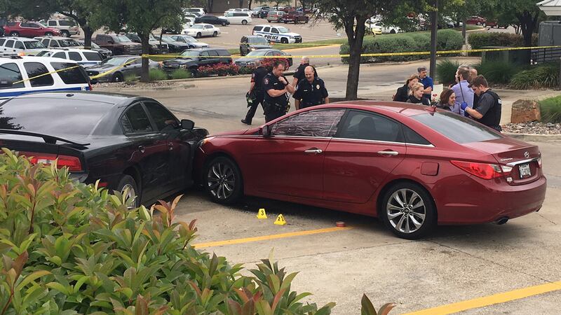 The red car in which the victim was sitting lurched forward and collided with another vehicle...