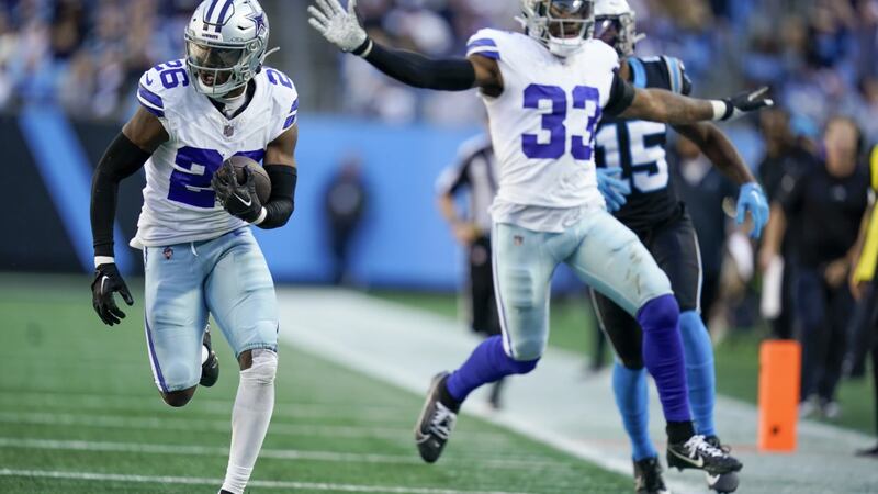 FILE - Dallas Cowboys cornerback DaRon Bland runs for a touchdown after intercepting the pass...