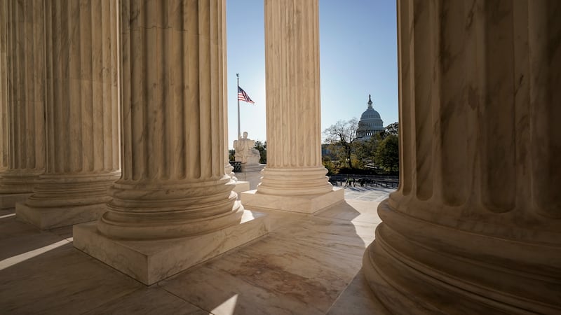 FILE - The Supreme Court is seen in Washington, with the U.S. Capitol in the distance, Nov. 4,...