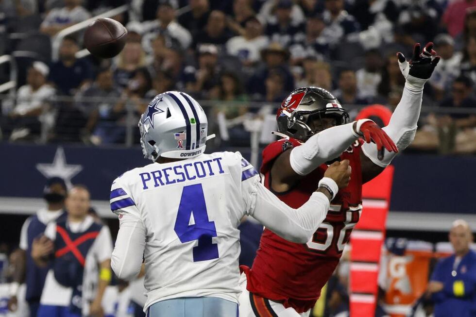 Dallas Cowboys quarterback Dak Prescott (4) is hit by Tampa Bay Buccaneers linebacker Shaquil...