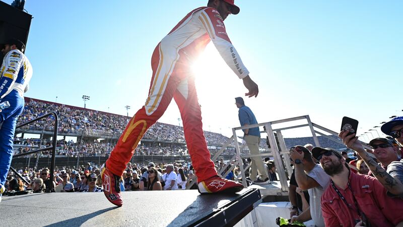 Bubba Wallace greets fans prior to a NASCAR Cup Series auto race at Darlington Raceway,...