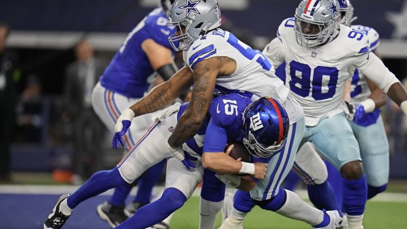 New York Giants quarterback Tommy DeVito (15) is sacked by Dallas Cowboys defensive end Sam...