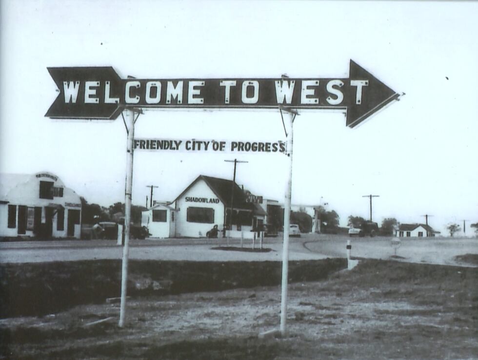 Photo of a sign from the early 20th century that proudly proclaims West as the “Friendly City...