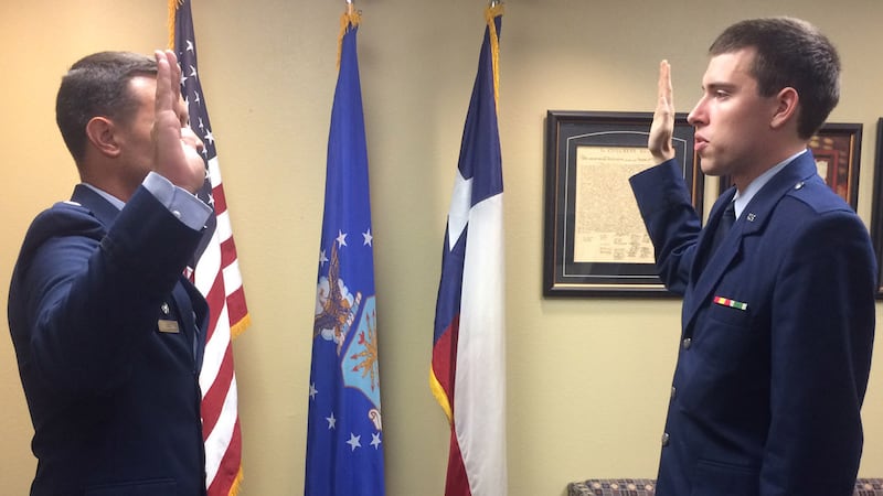 Chris Delzell (right) was commissioned Friday. (Photo by John Carroll)