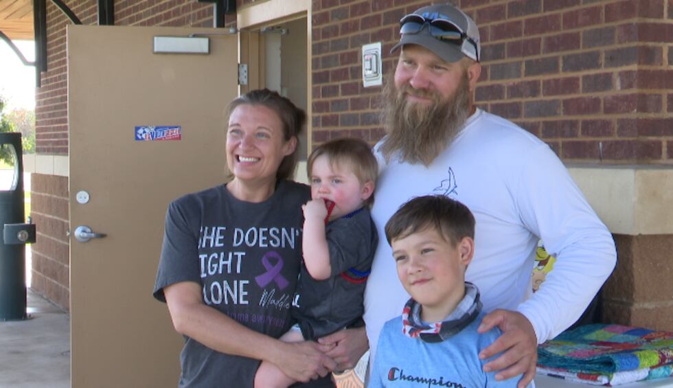 Maddie Proctor and her family pose for pictures at the third annual 3V3 soccer charity event...