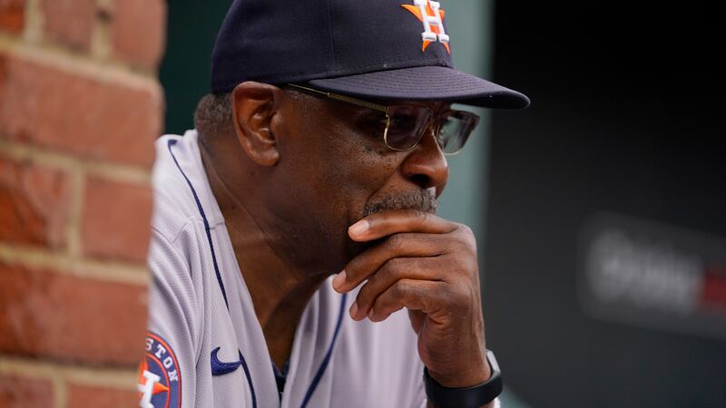 FILE - Houston Astros manager Dusty Baker Jr. looks on from the dugout in the third inning of...