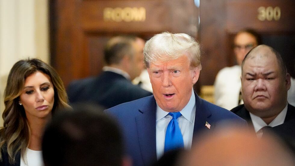 Former President Donald Trump, center, arrives at New York Supreme Court, Monday, Oct. 2,...
