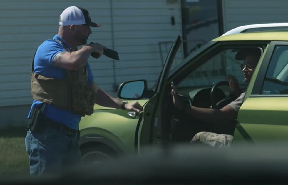 Detective Scaramucci detains a suspect in a sex trafficking sting.