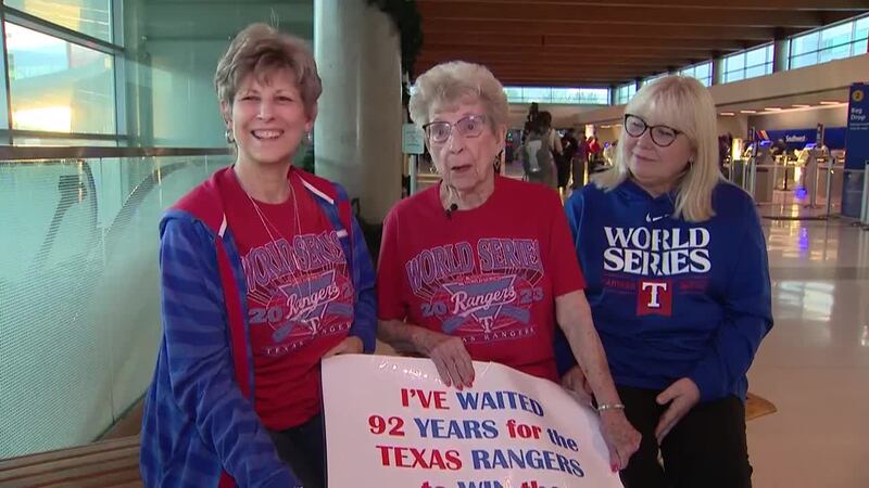 With her sign that read “I’ve waited 92 years for the Texas Rangers to win the World Series,”...