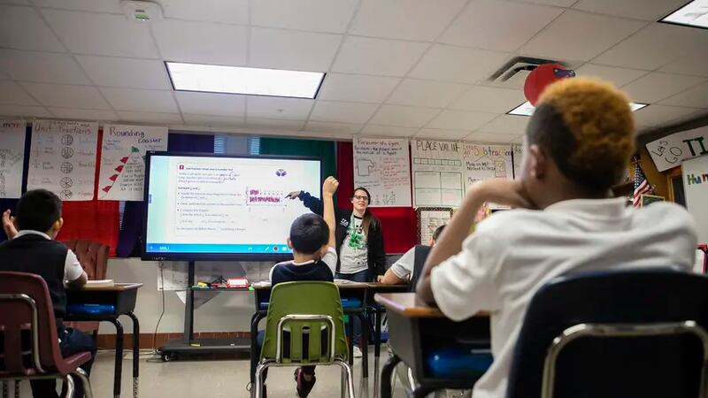 FILE- Jessica Lemmer goes over a fraction problem with her third grade math class on Jan. 14,...