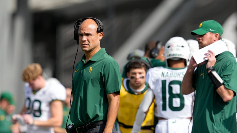 Baylor head coach Dave Aranda, center left, stands on the sidelines during an NCAA college...
