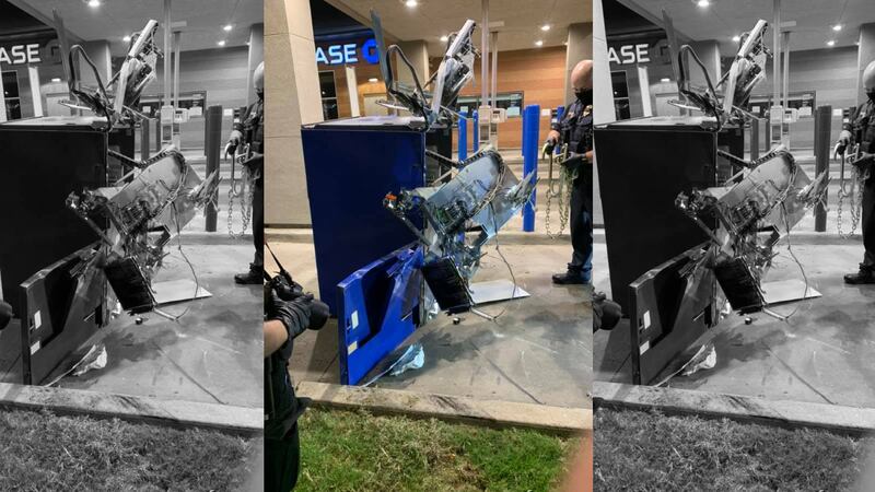 Police say a truck and a chain were left attached to the ATM, which was found in a parking lot.