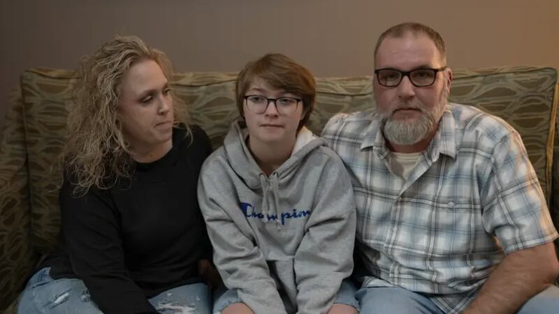 Amy and Phillip Hightower sit with their son Max Hightower in a hotel in Denton on Nov. 9,...