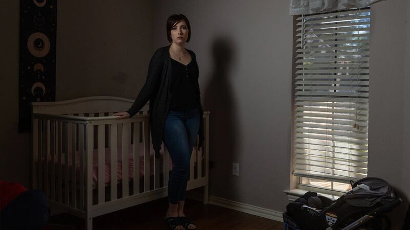 Lauren Hall stands for a portrait on Sept. 10, 2022, in the room that she and her husband had...