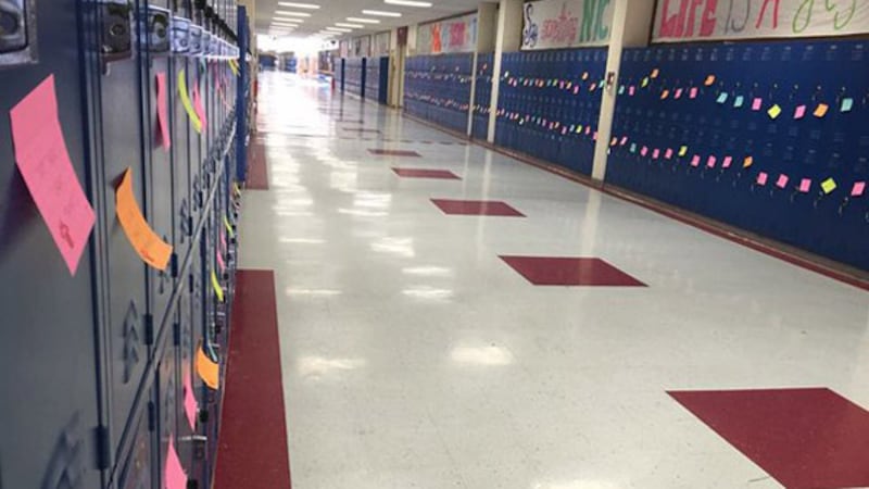 Post-it notes with encouraging messages were stuck on lockers throughout the school. (Photo by...
